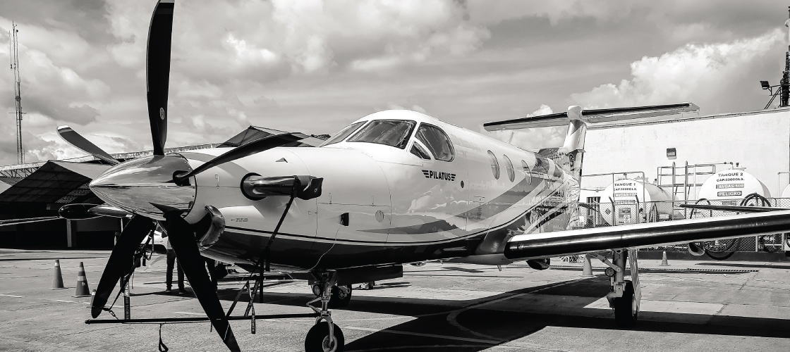Grayscale photo of Pilatus plane